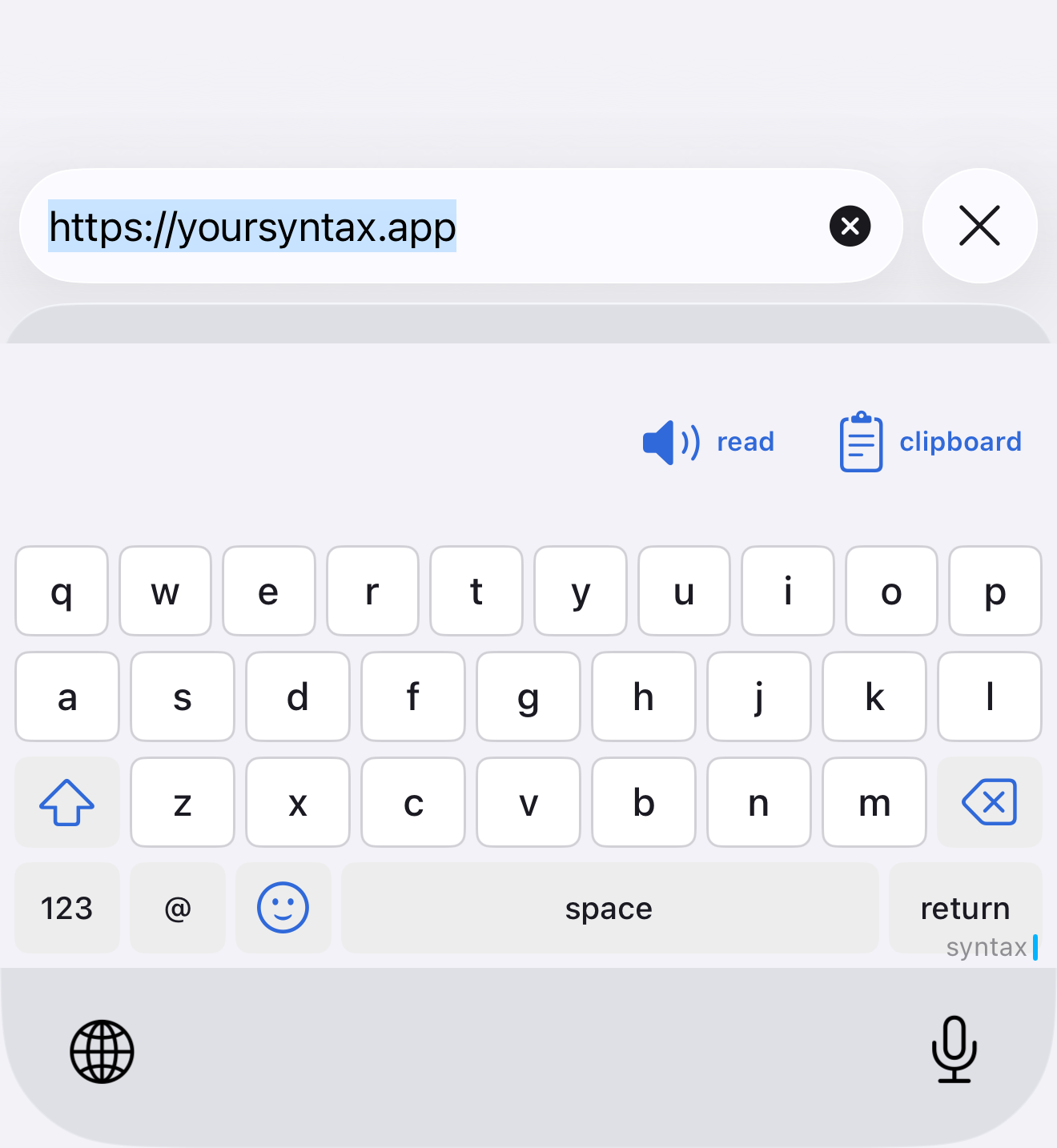 The syntax keyboard open under a browser address bar, with read and clipboard controls above the letters.